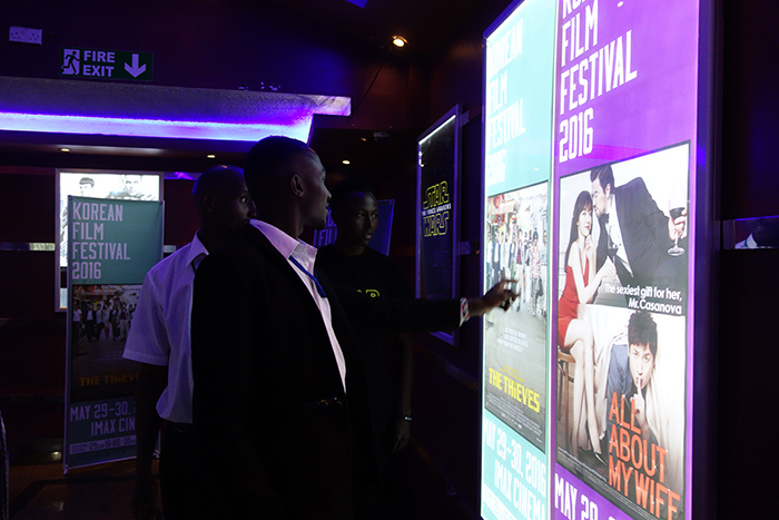 Movie-goers peruse their options at the Korean Film Festival that opens on May 29 at the Imax Theatre in Nairobi.