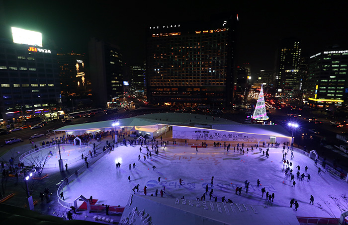 People skate on the ice rink opened in December last year at Seoul Plaza in front of Seoul City Hall, giving them a respite from the forest of buildings. 
