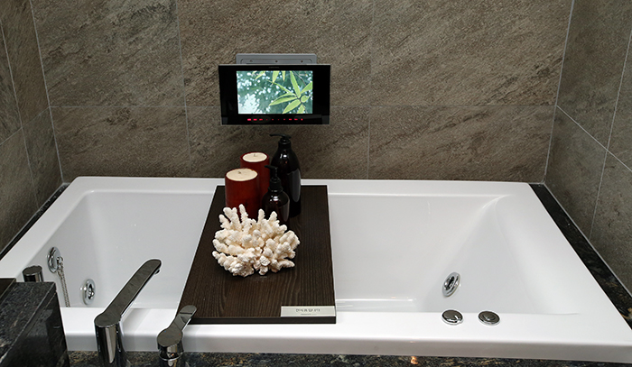  A monitor installed in the bathroom in the master bedroom allows residents to open the door and to make telephone calls. 