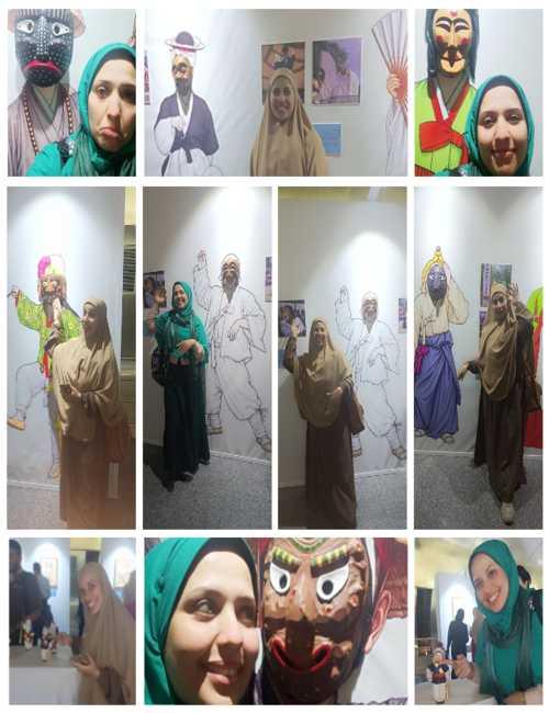 صوري أنا وأختي ندى مع رسومات الأقنعة الكورية (الصور من المراسلة مريم طه جاويش)